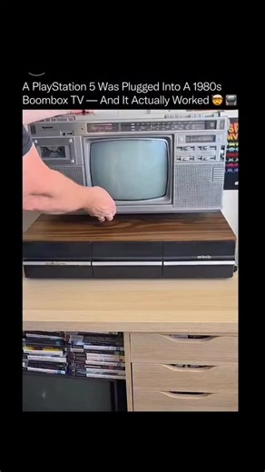 science || tech || history on Instagram: "A modern PlayStation 5 pushing graphics through a 1980s boombox CRT should not be possible, yet it works flawlessly. 📺 🎮 This setup bridges two completely different eras of technology, using modern digital hardware adapted to analog signal standards that predate HDMI by decades. The PS5 outputs a high-resolution digital signal, which is then converted through composite video adapters to match the low-resolution, analog input of a vintage CRT television
