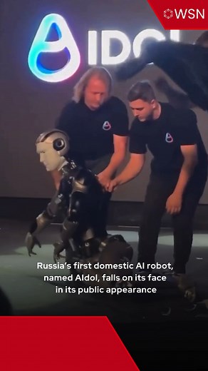 Footage shows Russia’s first domestically produced AI-powered humanoid robot, named AIdol, falling face-first onto the stage just seconds after its debut during a tech showcase on Monday. The robot made its first public appearance when it started waving at the audience, before taking a few steps, losing balance, and crashing onto the floor, leaving several broken pieces behind. The robot was accompanied on stage by two staff members on the soundtrack “Gonna Fly Now,” from the film ‘Rocky’ at the