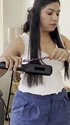 Woman melts plastic comb while straightening her hair