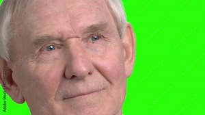 Close up senior man face looks around. Old man's face motion and facial expressions, hromakey background for keying.