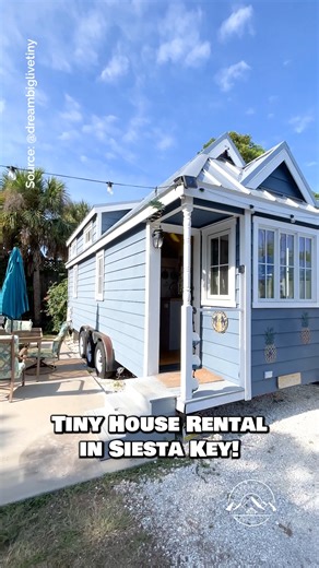 Would you stay in the "Pina Colada" tiny house rental in Siesta Key, Florida for a weekend? Inside, this tiny house features a small living space with a couch, a kitchen with apartment-size appliances, a closet, a bathroom, a main-floor bedroom, & a bonus loft bedroom--sleeps a total of 3 people! Located at Tiny House Siesta & built by Tumbleweed Tiny House Company 🏡 #tinyhouse #tinyhome #bungalow #cottage #siestakey | Dream Big Live Tiny Co.
