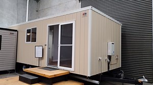 Here we have a detailed walk around of our Tiny Home range of buildings known as the "Plug n Stay' range. NO COUNCIL APPROVAL REQUIRED The building in the video is a 9m x 3.4m with one bedroom, one bathroom, kitchen area and living room. Visit www.ajcportables.com.au for instant pricing on our entire range | AJC Modular