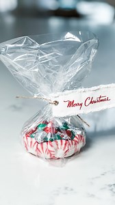 Peppermint Candy Bowl DIY! Looking for a fun and festive holiday project? Try making your own peppermint candy bowl! Line a baking sheet with parchment paper and give it a quick spray of non-stick cooking spray. Start by placing one peppermint in the center, surrounded by 6 more. Repeat this with 12 more peppermints, ensuring they all touch. Pop it into a preheated 300F oven for about 8 minutes, or until they become shiny and just start to melt. Once done, let it cool for 1 minute, then carefull