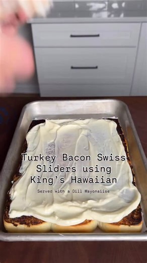 Turkey Bacon Swiss Sliders with Dill Mayonnaise. Recipe ⤵️ Dill Mayo: * 1 cup mayo * 1/2 cup chilli sauce * 1 Tbsp apple cider vinegar * 1 tsp pepper, * 4 Tbsp dill relish * 4 Tbsp sugar * 2 tsp celery seed * 1/4 tsp salt Cooking: * Using @kingshawaiian Original Slider Rolls, cutting them in 1/2 and toasting both sides * To your @kingshawaiian rolls, add Mayo, Turkey, bacon, Swiss cheese * Brush some melted butter on top buns * Bake at 350° for 15-20 minutes * Serve it with your dill Mayo and en