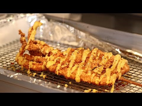 This Place Has Giant Fried Squid On A Stick
