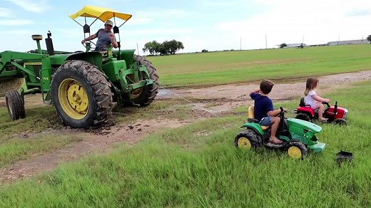 Playing in the mud and pulling real tractor out of the mud _ Tractors for kids 🚜🚜#tractor #Kid #Toy #Tractorsforkids #farm #farmboy #hudsonsplaygrou