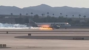 Terrifying moment flaming Frontier plane makes landing in Las Vegas