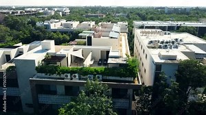 Explore luxurious apartments with rooftop pools in a stunning drone video. From above, witness the beauty of real estate and serene swimming pool views.