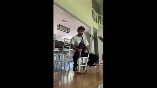 Man spins on flipped stool in Charlotte, North Carolina