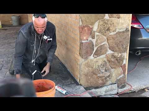 How to caulk concrete floor or driveway up against a wall.