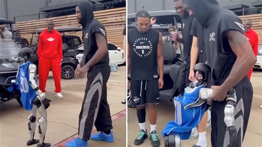 Video: Humanoid robot knocked down playfully by US basketball star