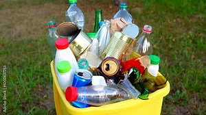 Bottles in Waste container. Waste sorting for Recycling. Glass bottle in trash bin container. Garbage Sorting. Trash bin bucket. Throwing bottles in trash can. Waste container with plastic bottles. Stock Video