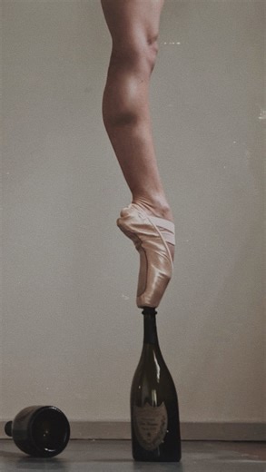 Bekah on Instagram: "It’s way past the moment for this audio, but it just fit too well to not use. @theincredibleholt had been in my DMs begging me to try knocking the bottles over as I was walking, I was scared to break them so I never did. Turns out the image is definitely worth it! 🖤✨ #bottlewalking #ballet #pointe #bottlebalancing #circus"