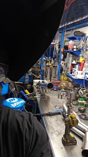 Tig welders down atm so the mig is the backup today. Adding Vibrant's 3" V-band Flanges to a pair of 3" Collectors on a pair of 304 stainless long-tube headers for a Coyote. Stitch welding the flange with 308 .035 mig wire. #makeitwork #vibrantvband #304stainlesssteel #mig #coyote #longtubeheaders #krwcustomexhaust #vband #fordperformanceshop | KRW Performance & Customs