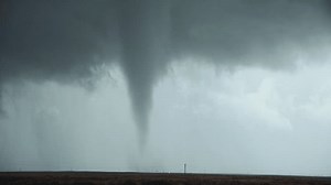 A Tornado Churns In A Field During a Severe Weather Outbreak In Tornado Alley