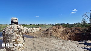 Libya crisis: Air strike at Tripoli airport as thousands flee clashes