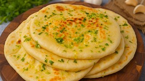 47K views · 464 reactions | Soft fluffy garlic butter naan recipe | Eggless garlic naan recipe | Yummy Recipes | Facebook