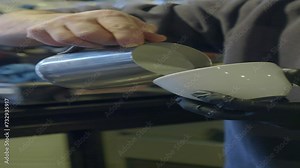 pours draws milk over a coffee , the concept of making latte art for cappuccino