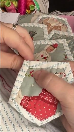 Hand finishing quilt as you go pentagons using Tilda Merry Little Christmas