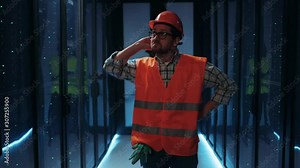 Electrical technician standing in middle of server room, inspecting and repairing electricity, experiencing power failure and blackout. Dark data center.