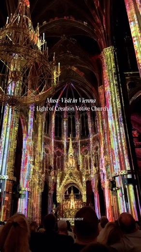 Budapest Tips, Trips & Eats┃Iris Dias on Instagram: "Comment “CHURCH” to send you the link directly to your DMs! 🕯️✨Reklám Vienna’s Most Magical Light Show ⛪️💫 The light show at Votive Church is an absolute must-see. Here is why: • Immersive Art: It transforms one of Vienna’s most beautiful cathedrals into a canvas of color. • The Vibe: A perfect blend of history, spiritual atmosphere, and modern technology. • Photo Op: Every corner is a dream for your feed Truly an unmissable experience in th