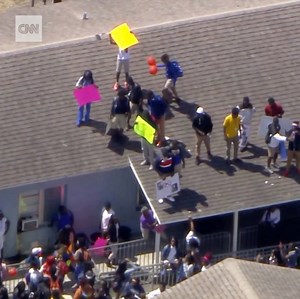 These students in Miami walked out of their school -- some getting on top of buildings -- to protest gun violence after four people were shot nearby over the weekend | CNN