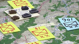 Retired Col. Al Porto and retired Col. Michael Scotto discuss The Battle of the Bulge during a military history brown bag lunch Dec. 15 at the 99th Regional Support Command. The overall topic for the day was an interactive "Wacht AM Rhein" strategic gaming discussion. | 99th Regional Support Command