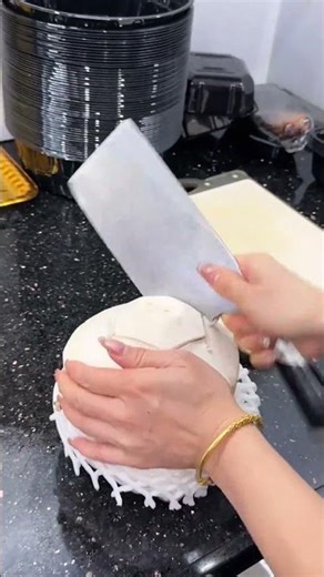 Correct opening process of the coconut using a kitchen knife