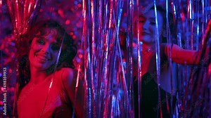 Two Young Girls Dancing In Nightclub Between Sequins. Blonde And Brunette In Evening Dresses.