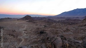 Harsh rocky desert landscape of Alabama Hills at sunset, Lone Pine; aerial