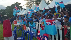 Fiji fans singing with their Samoan conductor after the 7s sides won double gold at the Pacific Games. | FBC Sports