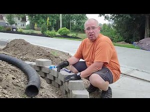 DIY Curved retaining wall project for a flower bed extension