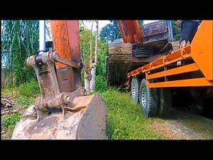 Here's a step-by-step guide to loading and unloading an excavator onto a self-loader truck.