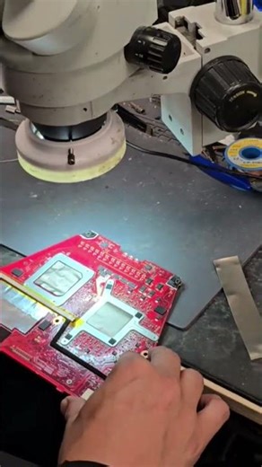 Checking the motherboard with a microscope