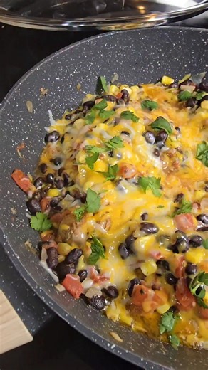 Santa Fe Chicken Skillet here's the recipe. 3 chicken thighs 2 tbs avocado oil 1/2 tsp of each- garlic powder, onion powder, smoked paprika, chili powder- salt and pepper to taste 1 c frozen corn- thawed 1 can rotel diced tomatoes with green chilies 1 can black beans rinsed and drained 3/4 c Mexican blend shredded cheese You can eat this by itself or served with rice. Easy to make and damn good. Go make it. | Kate Jackson