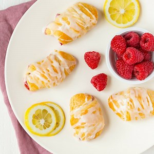 20K views · 138 reactions | Crescent rolls filled with sweet raspberries and topped with a lemon glaze. The Easiest Raspberry Lemon Crescent Rolls require only 6 ingredients. Get the recipe --> https://www.bakedbyanintrovert.com/easiest-raspberry-lemon-crescent-rolls/ | Baked by an Introvert | Facebook