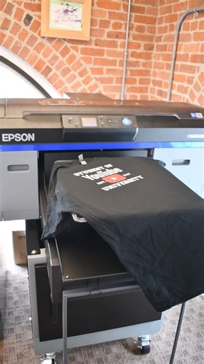 2.2K views · 102 reactions | Printing directly onto a garment has never been so easy! The Epson F2100 delivers speed, sharpness, and a soft hand feel that will make business production a breeze. Get yours today with bundles starting at $10,995! #Epson #EpsonF2100 #Esponprinter #DTG #DTGprinting #directtogarment #tshirtprinting #tshirtshop #smallbusiness #heatpress | Swing Design | Facebook