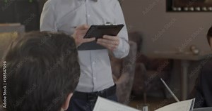 Two men reading menu in a restaurant