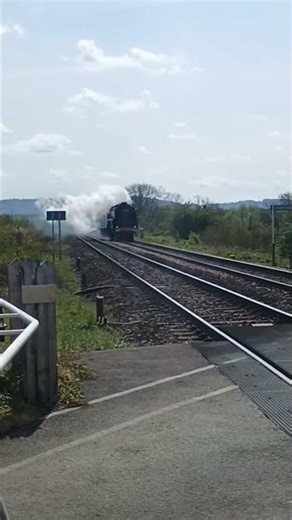 71000 Duke of Gloucester passing a crossing near Cheltenham