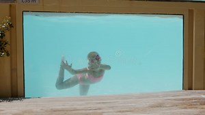 Young Girl Swim Tricks through Underwater Pool Window Display Stock Footage - Video of aquatic, swim: 350110804