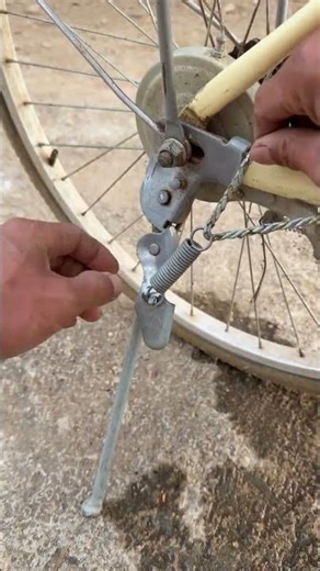 The process of installing a bicycle kickstand tension spring with a rope