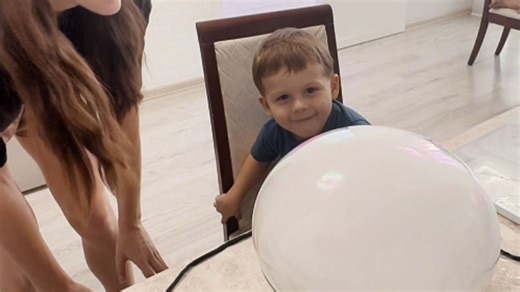 Dry ice bubble swells over bowl and pops during home experiment