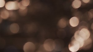 Video of flickering yellow bokeh spots of light with copy space | Premium Stock Video Footage