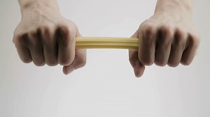 Hands Breaking Spaghetti Noodles In Half Stock Footage SBV-330130414 - Storyblocks