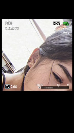 Close-Up Portrait of a Young Adult with Dark Hair