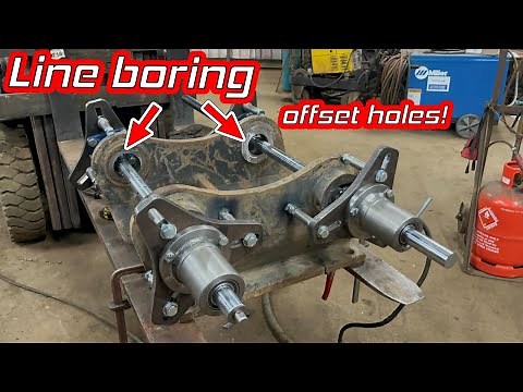 Line boring excavator bracket. Offsetting holes to change pin centres.