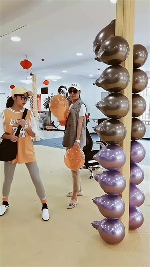 She pops balloons in an amazing WAY