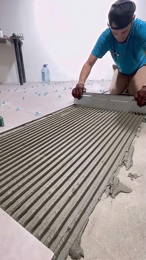 the process of installing ceramic tiles on the floor