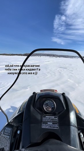Snowmobile Adventure Across Snow-Covered Landscape