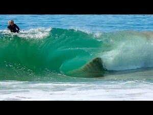 Surfers Try to Ride Dangerously Shallow Wave on a Disappearing Sandbar